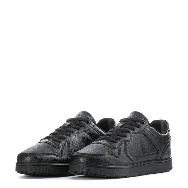 Pair of black low-top lace-up sneakers with padded collar and rubber cupsole