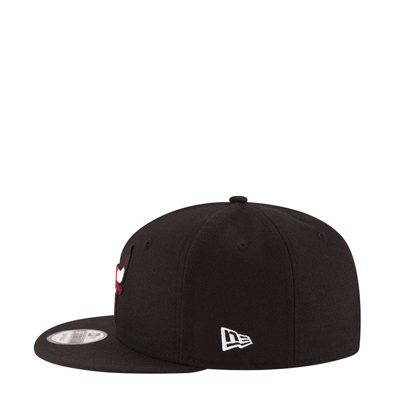 Black baseball cap with curved brim and small side logo patch