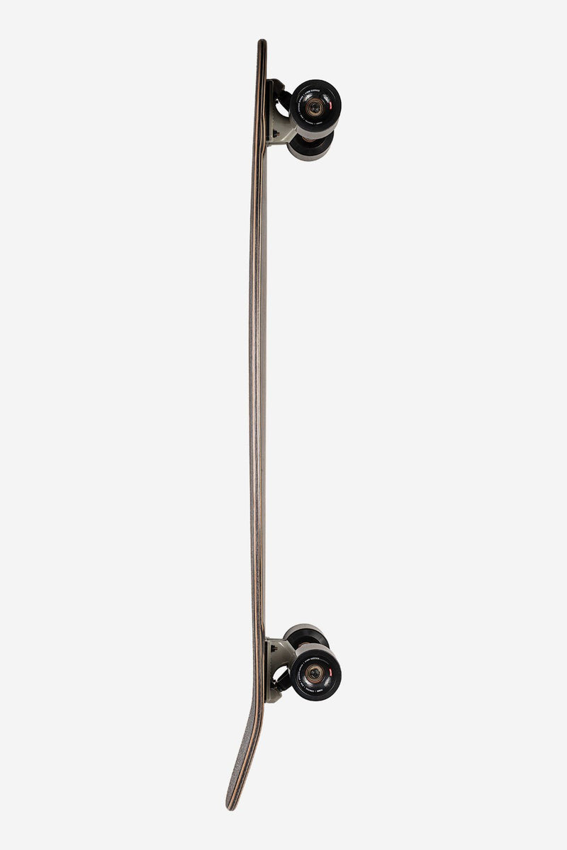 Vertical side shot of Byron Bay 43 longboard Ebony Nightshade with mounted trucks