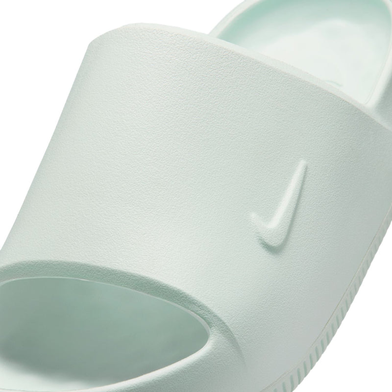 Mint slide sandal close-up of cushioned upper and Nike Swoosh