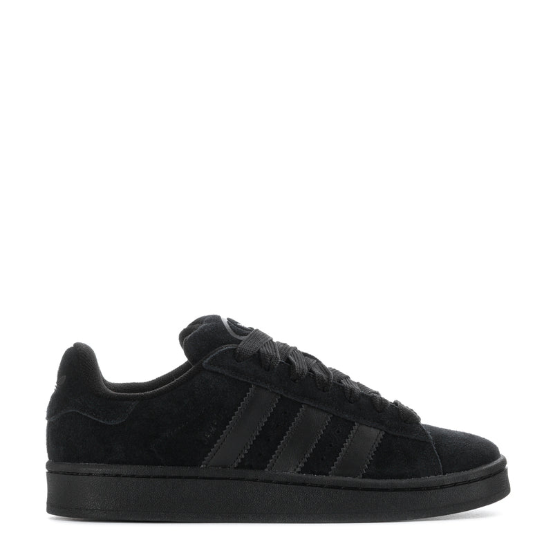 Black suede low-top sneakers with three-stripe detail and lace-up closure