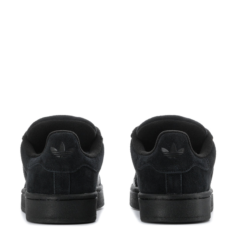 Black suede sneakers, heel view with padded collar and stitched back panel