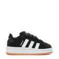 Toddler black suede sneakers with white adidas-style stripes and gum rubber sole