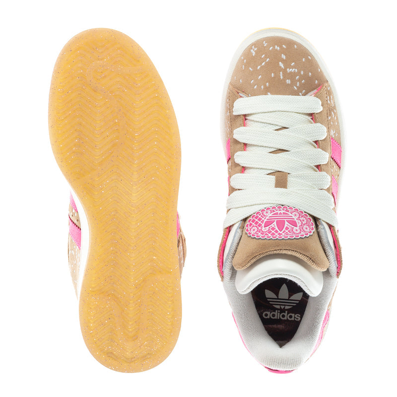 Women's sneakers outsole and insole view, tan tread and white laces; adidas branding