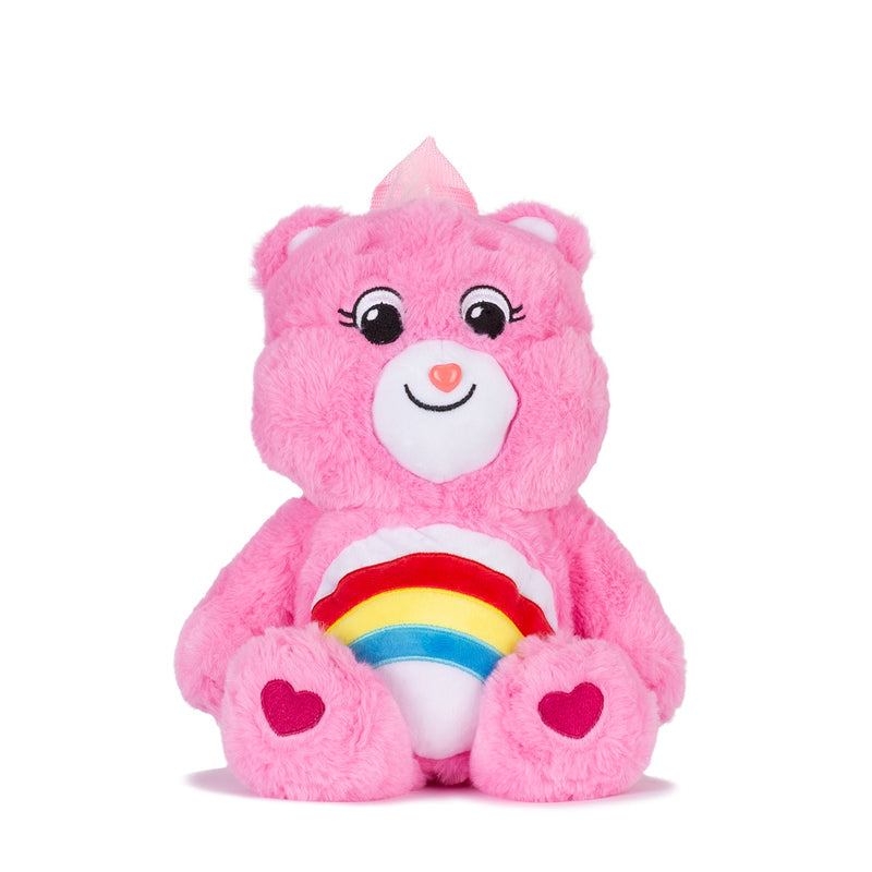Pink plush backpack with cute bear face and rainbow belly detail