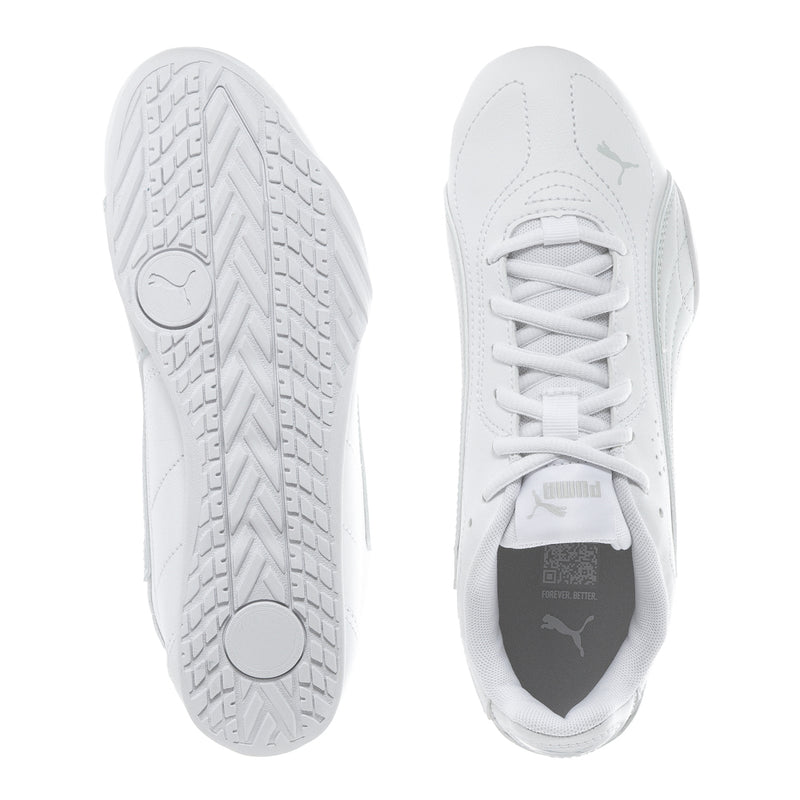 Youth low-top sneaker soles and heel view, white shoe with treaded outsole.