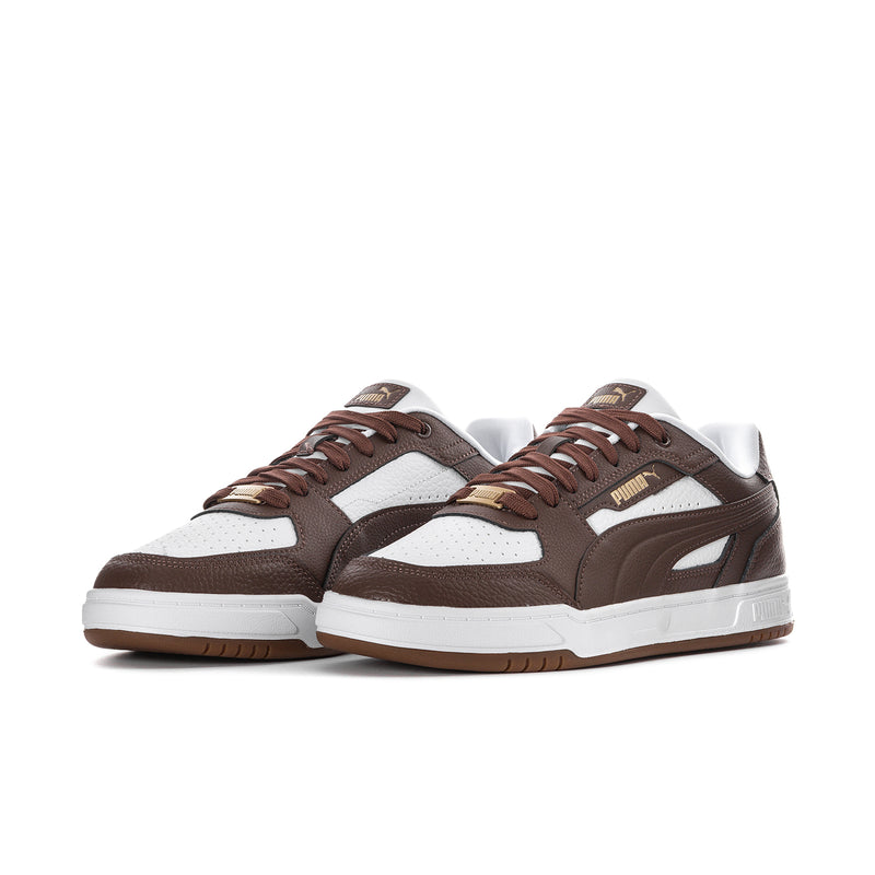 Pair of brown and white lace-up low-top sneakers with side stripe and Puma badge