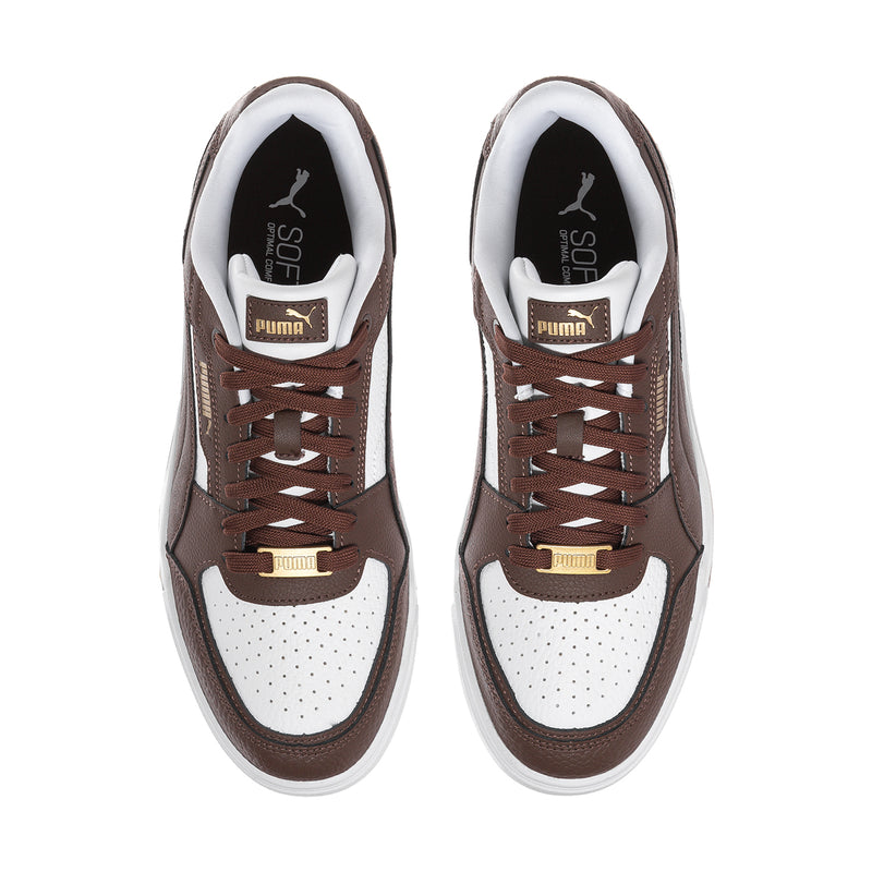 Brown and white lace-up sneakers viewed from front with Puma logo on tongue