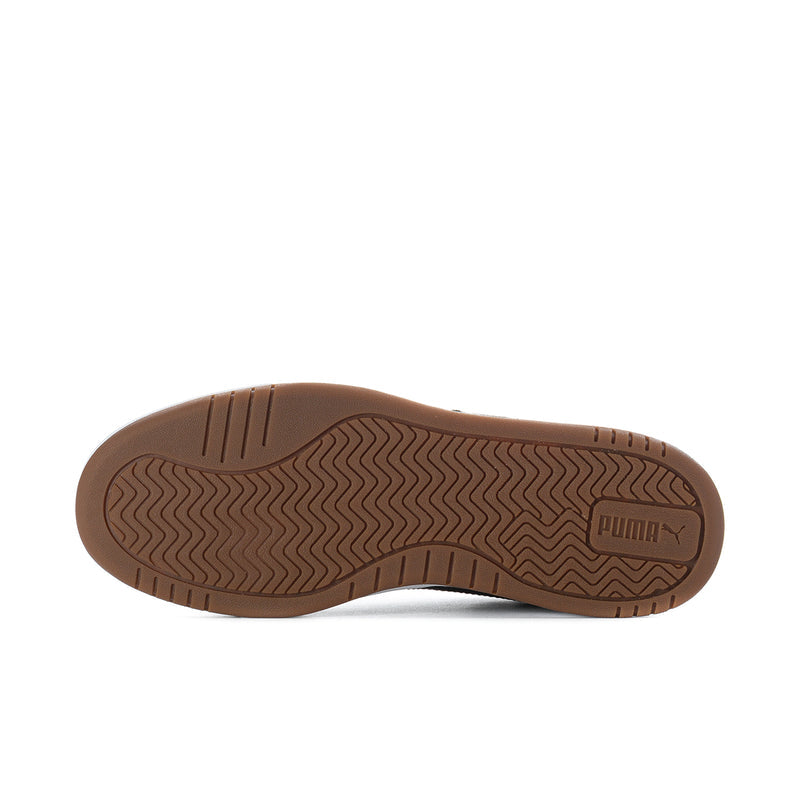 Puma Caven III outsole view with brown rubber tread and Puma logo.