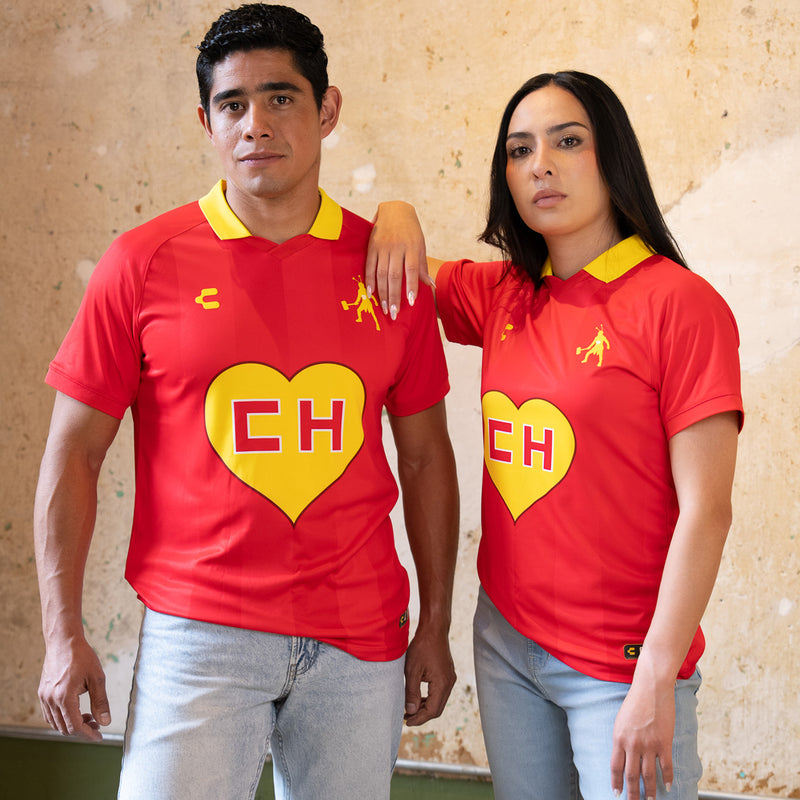 Men's red soccer jersey with yellow collar, EH heart logo and polo player emblem