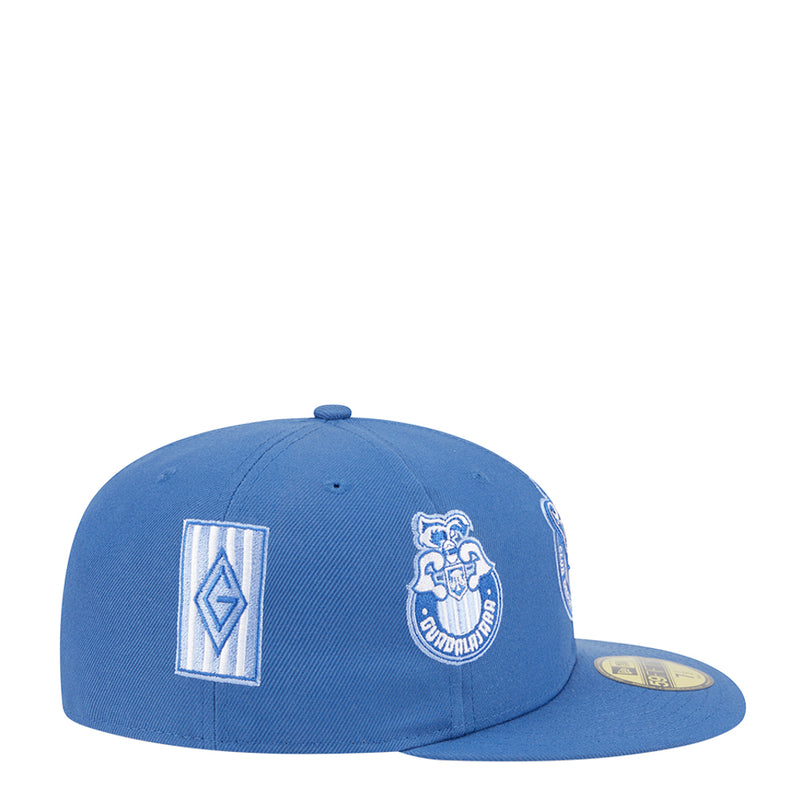 Blue baseball cap with side square monogram and embroidered crest