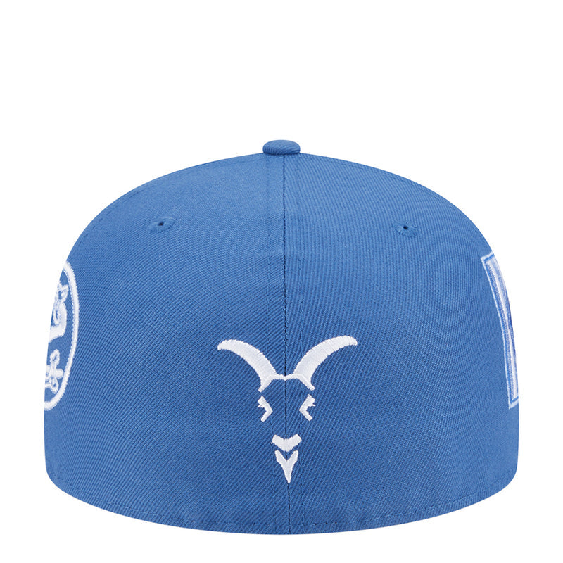 Blue baseball cap back with centered bull emblem and small side patches