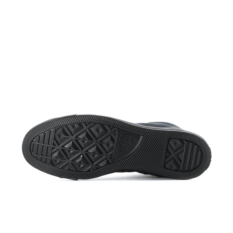 Black high-top sneaker outsole with textured star-pattern tread