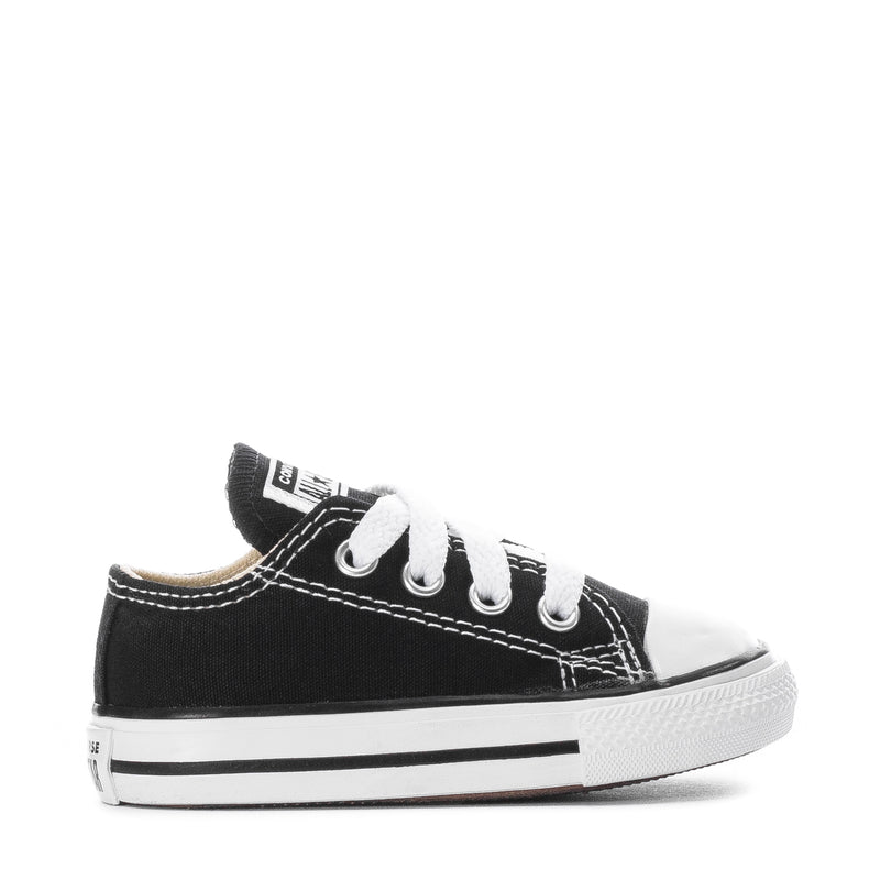 Toddler black Chuck Taylor All Star ox sneakers, side view with white laces and toe cap