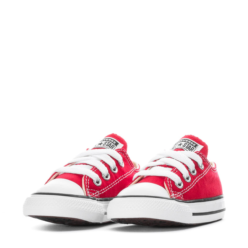 Pair of toddler red canvas low-top sneakers with white laces and star badge