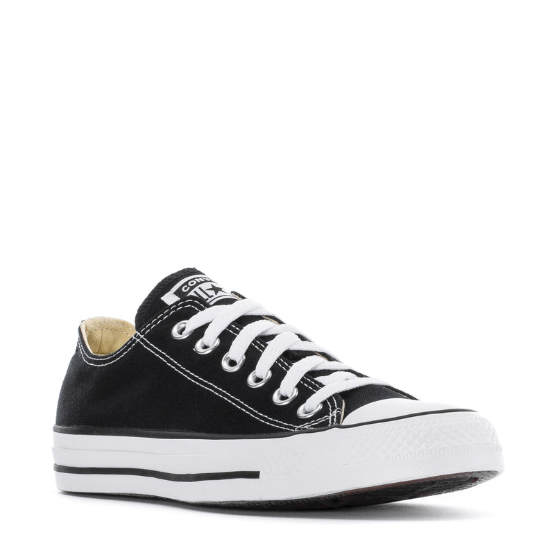 Youth black low-top canvas sneakers with white laces and white rubber sole