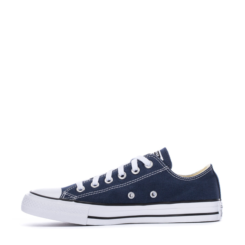 Youth navy canvas ox sneaker front side view with white laces and metal eyelets
