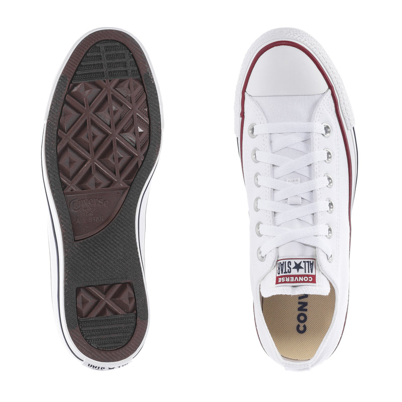 Youth optical white low-top sneakers showing outsole tread and lace-up front
