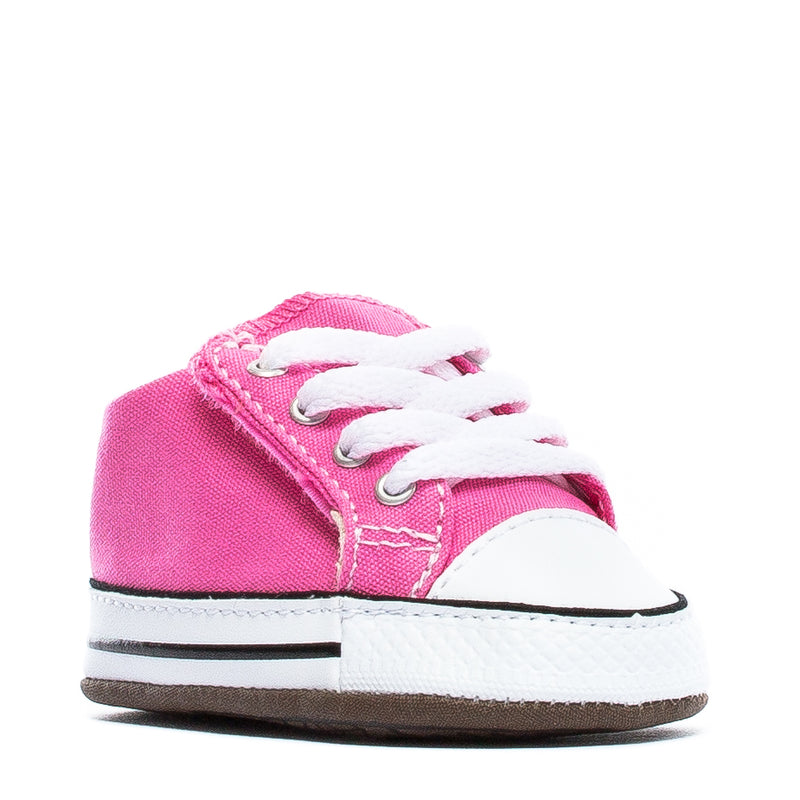 Infant Chuck Taylor crib shoes in pink fabric with white laces and white rubber sole