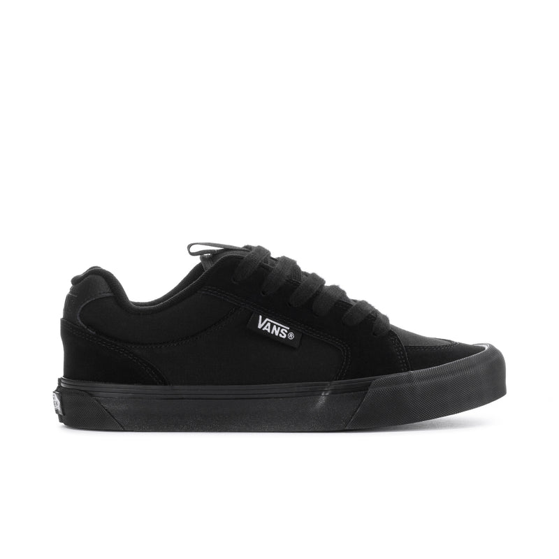Black lace-up chukka-style sneakers with Vans logo and rubber sole