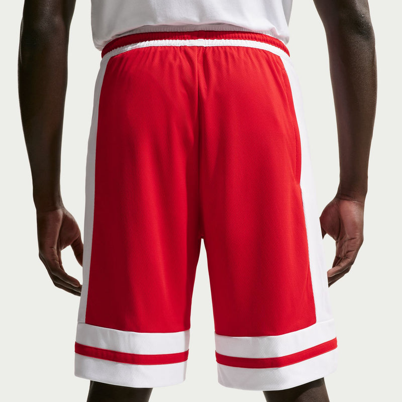 Back view of red basketball shorts with white waistband and striped hem