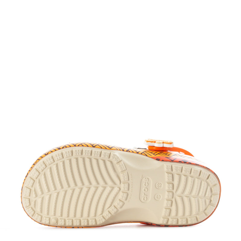 Kids' cream clog outsole with textured tread and orange edge trim