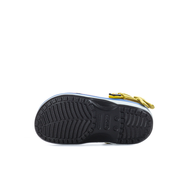 Kids clog outsole view with black tread and yellow heel strap