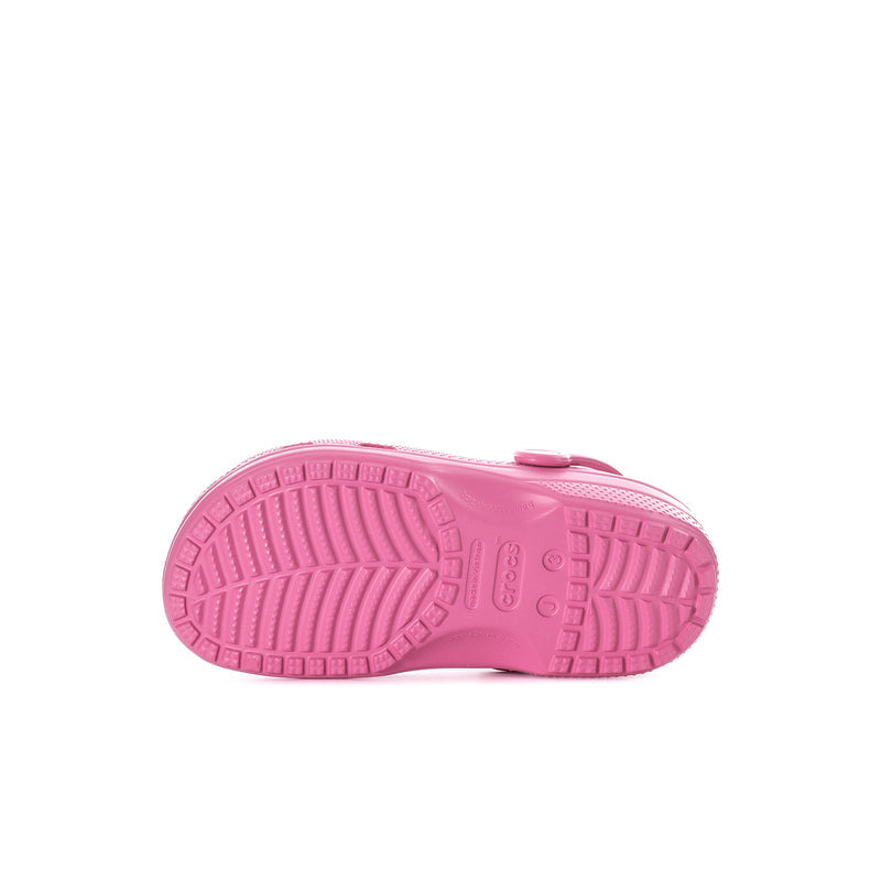 Pink kids' clog outsole with textured tread and molded ridges