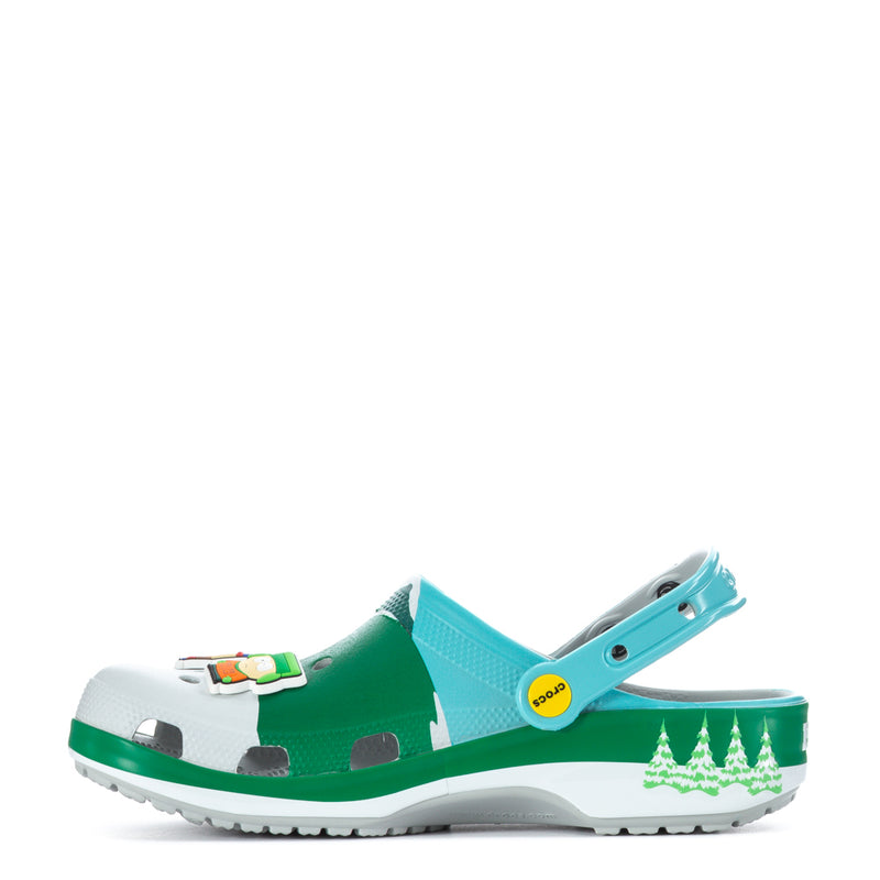 Men's clog in green and turquoise with white top and side strap badge.