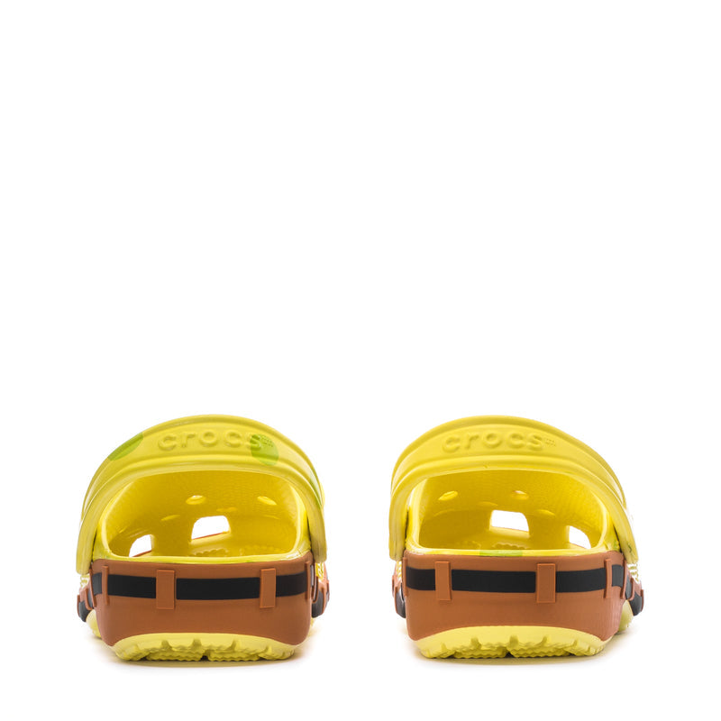 Men's yellow clogs, back view with embossed 'crocs' lettering and black orange outsole