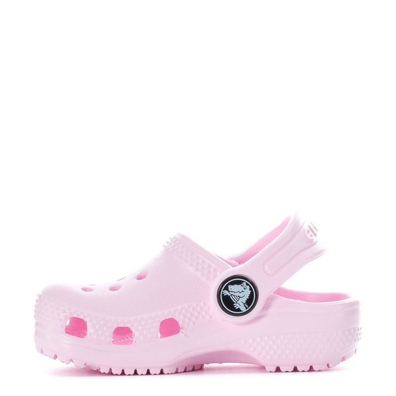 Pink toddler clog with side vents, circular logo badge, and ridged outsole