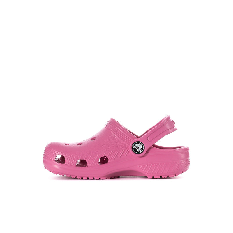 Toddler classic clog, quiet rose pink, angled side view with logo emblem and perforations