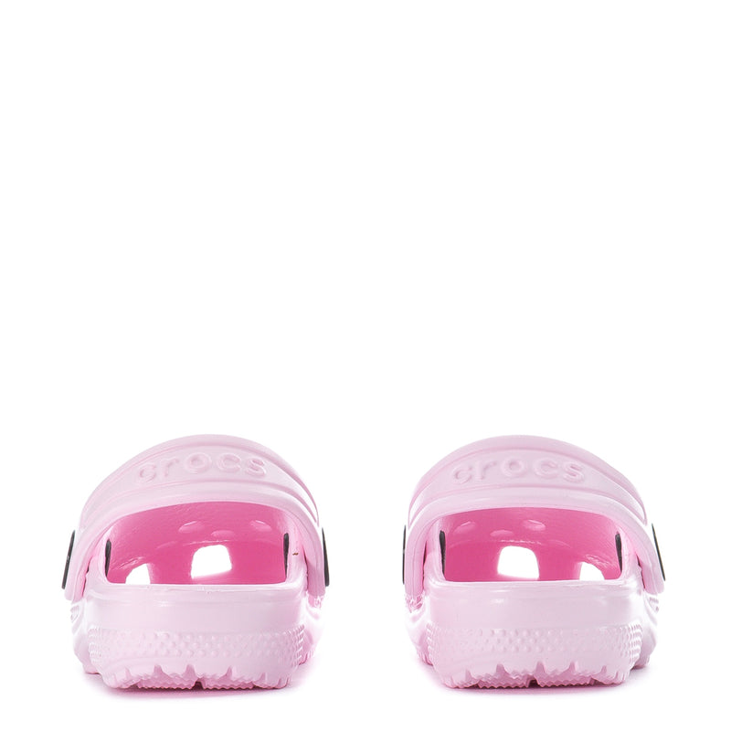Pink toddler clogs, front view with strap openings and molded ventilation texture