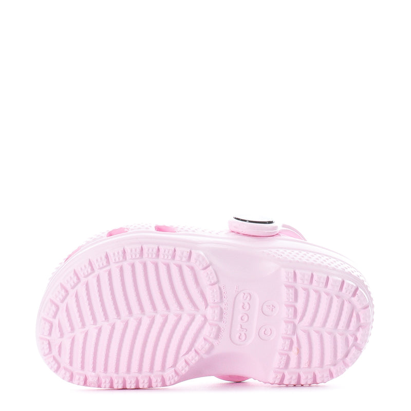 Pair of pink toddler clogs showing textured outsole tread and cushioned footbed