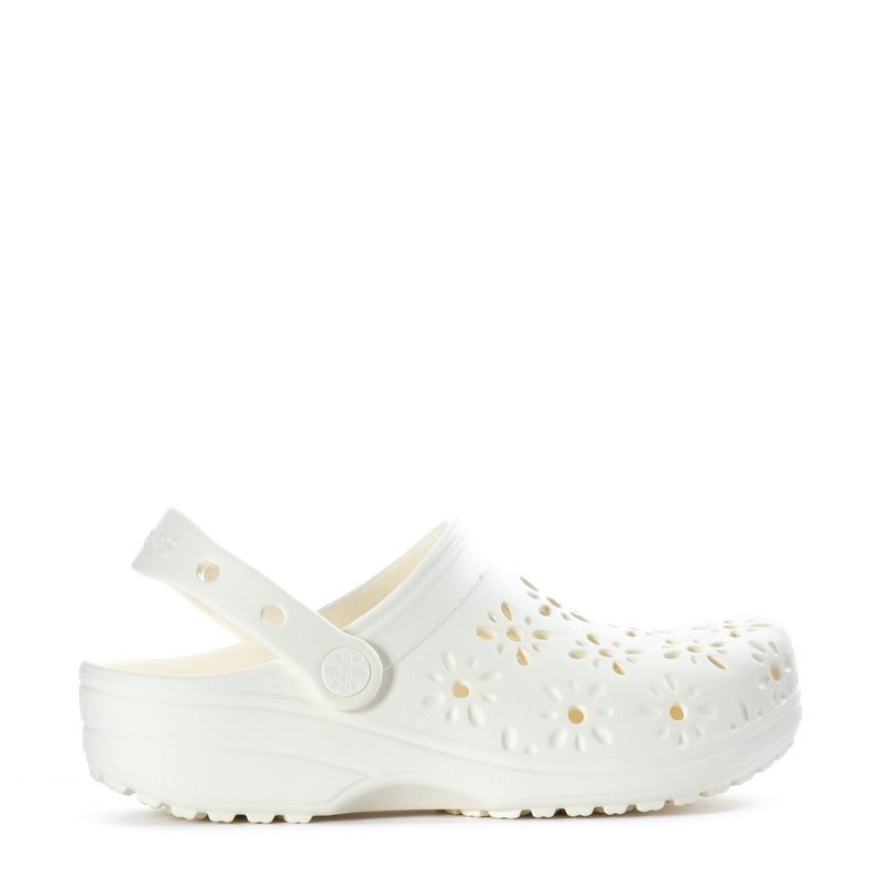 Women's clogs in white with floral cutout uppers and adjustable strap