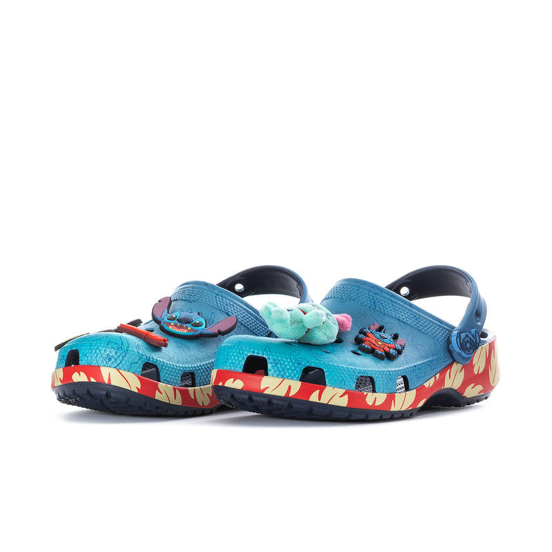 Women's blue cartoon clogs with multiple character Jibbitz and red flame trim