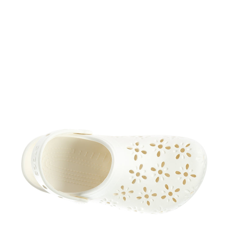 Women's white clog with interior footbed visible and floral cutout pattern