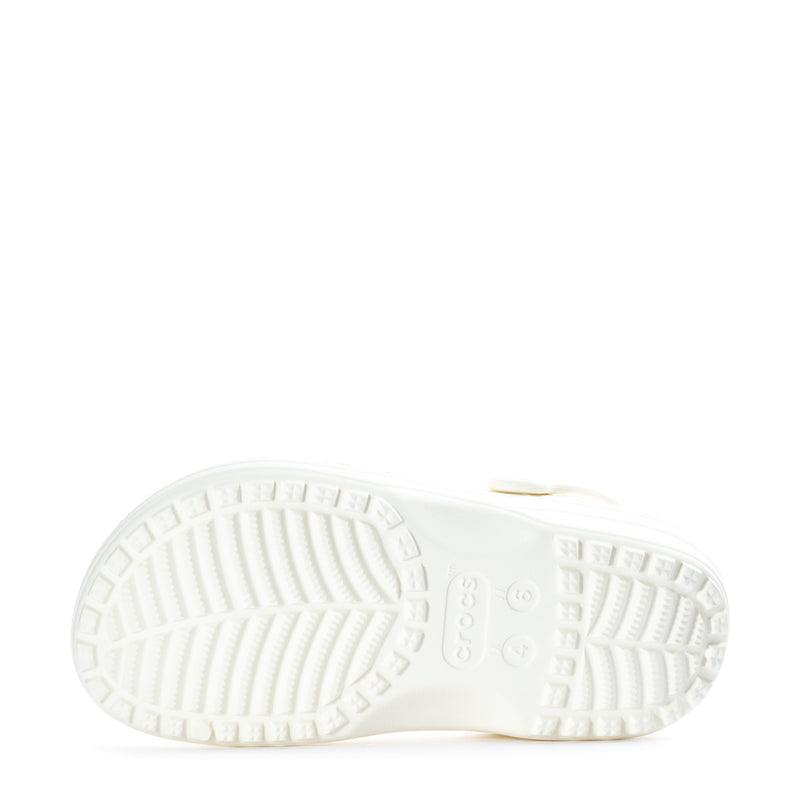 Women's white clog outsole view with traction tread and molded logo