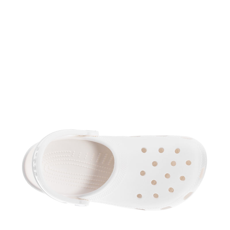 Youth white clog interior view with molded footbed and vented pattern.