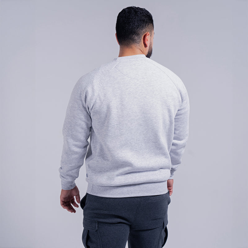 Men's heather grey fleece crewneck sweatshirt, back view on model, ribbed hem