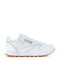 Toddler white leather sneakers with gum outsole, lace-up with Reebok logo.