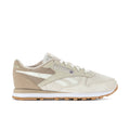 Women's cream sneakers with tan suede panels, white side stripes, lace-up