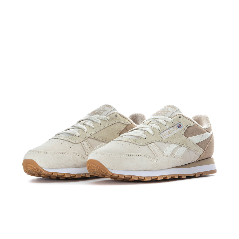 Women's cream sneakers with tan overlays, lace-up design, gum rubber sole