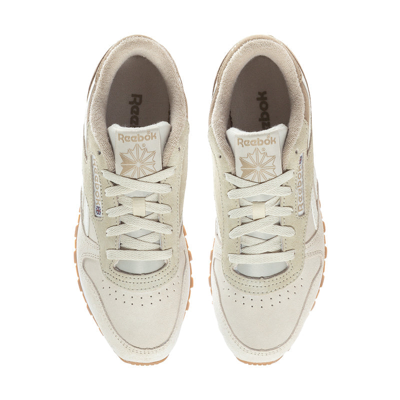 Women's cream lace-up sneakers with Reebok logo on tongue and perforated toe