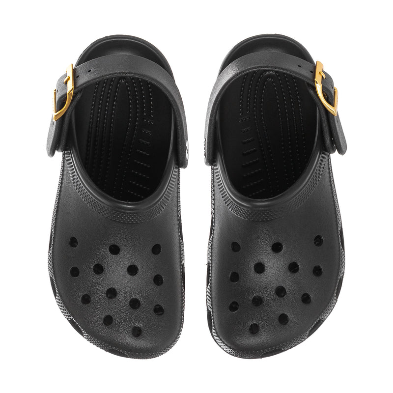 Womens black clogs with perforated upper and metallic buckle straps