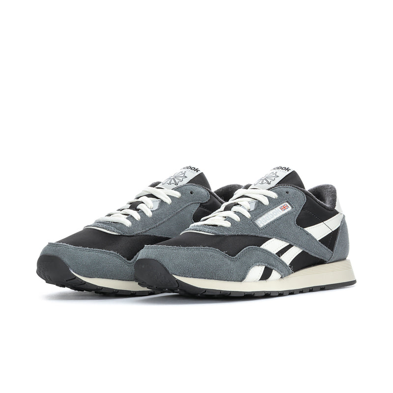 Men's nylon sneaker, side view in black and gray with white stripes and lace-up.