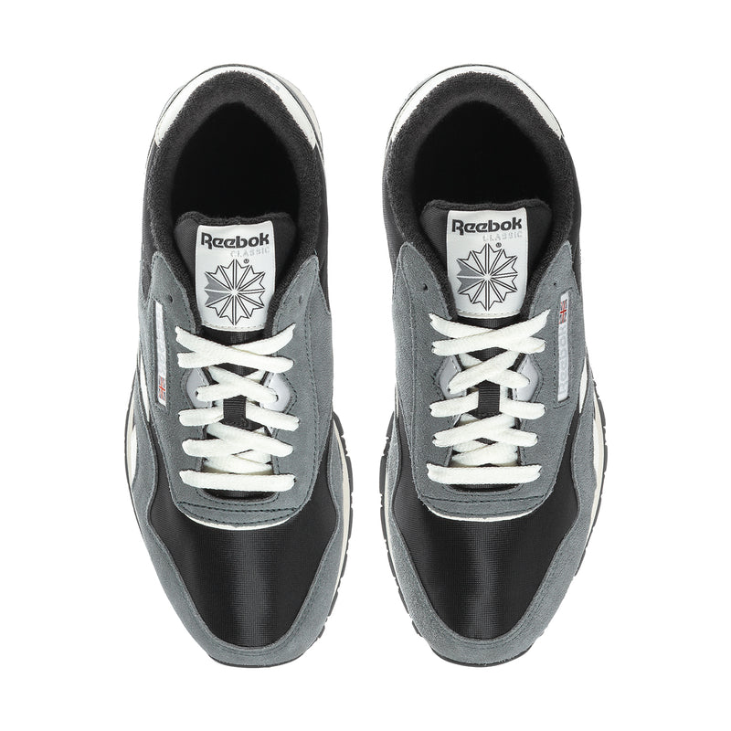 Men's nylon sneaker with black upper, gray panels, white laces, and Reebok logo.