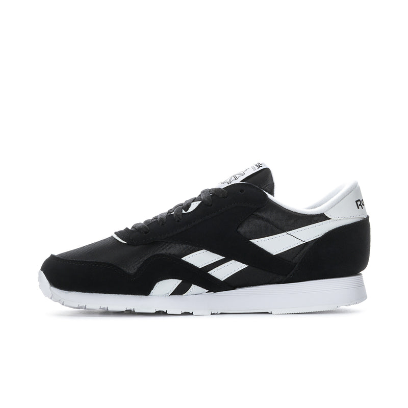 Men's black and white Reebok sneakers, side profile with striped quarter panels