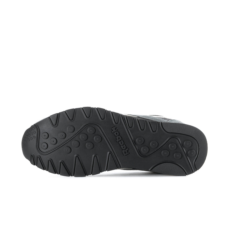 Men's nylon sneaker outsole, black rubber tread with Reebok logo.