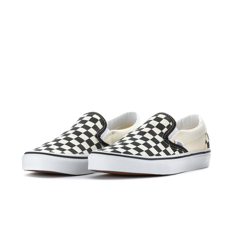 Pair of men's Vans slip-on sneakers, black and white checkerboard uppers, white sole
